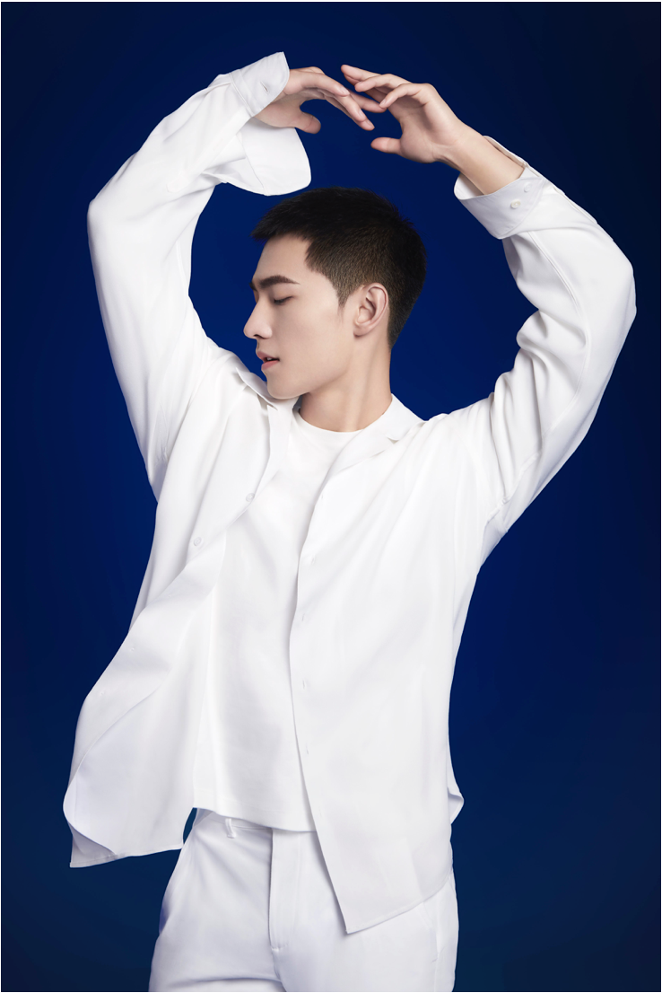 Yang Yang holding an orchid for Guerlain
